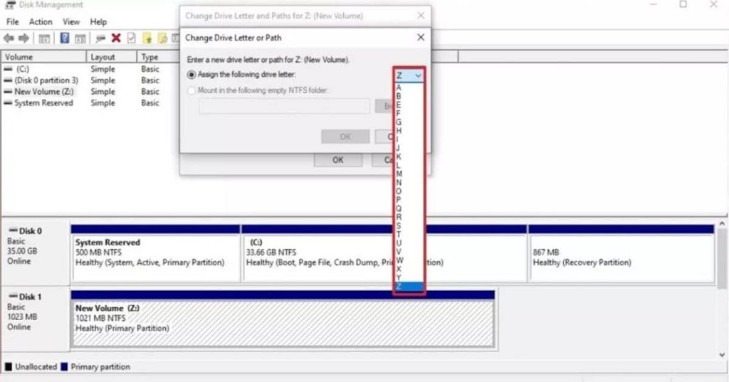 Check the box next to Assign the following drive letter, choose an available drive letter from the dropdown menu and click Next.